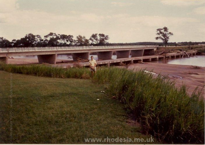 Bubye River Bridge, Rhodesia 1975. A fine example of 50 years progress taken from the Lion & Elephant Motel. The old low level bridge is covered with debris after heavy rains.
