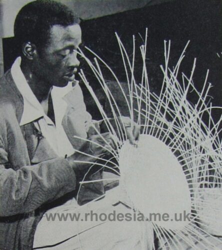 A blind patient, well taught, making a straw hat at Bulawayo